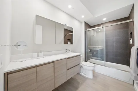 a room with a chair and white walls