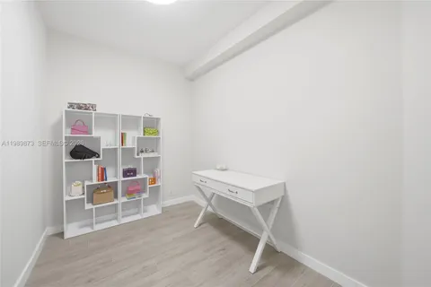 a view of a livingroom with a mirror