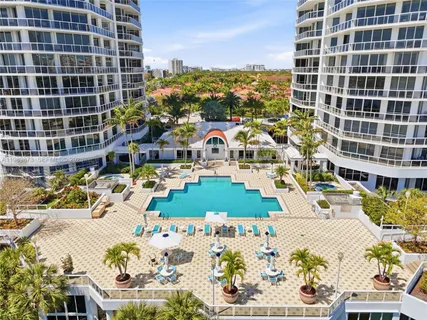 a view of a swimming pool with a lounge chair