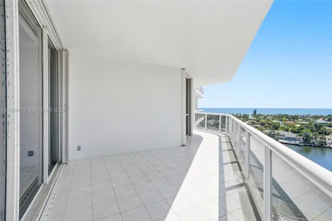 a kitchen with a sink cabinets and dining table chair