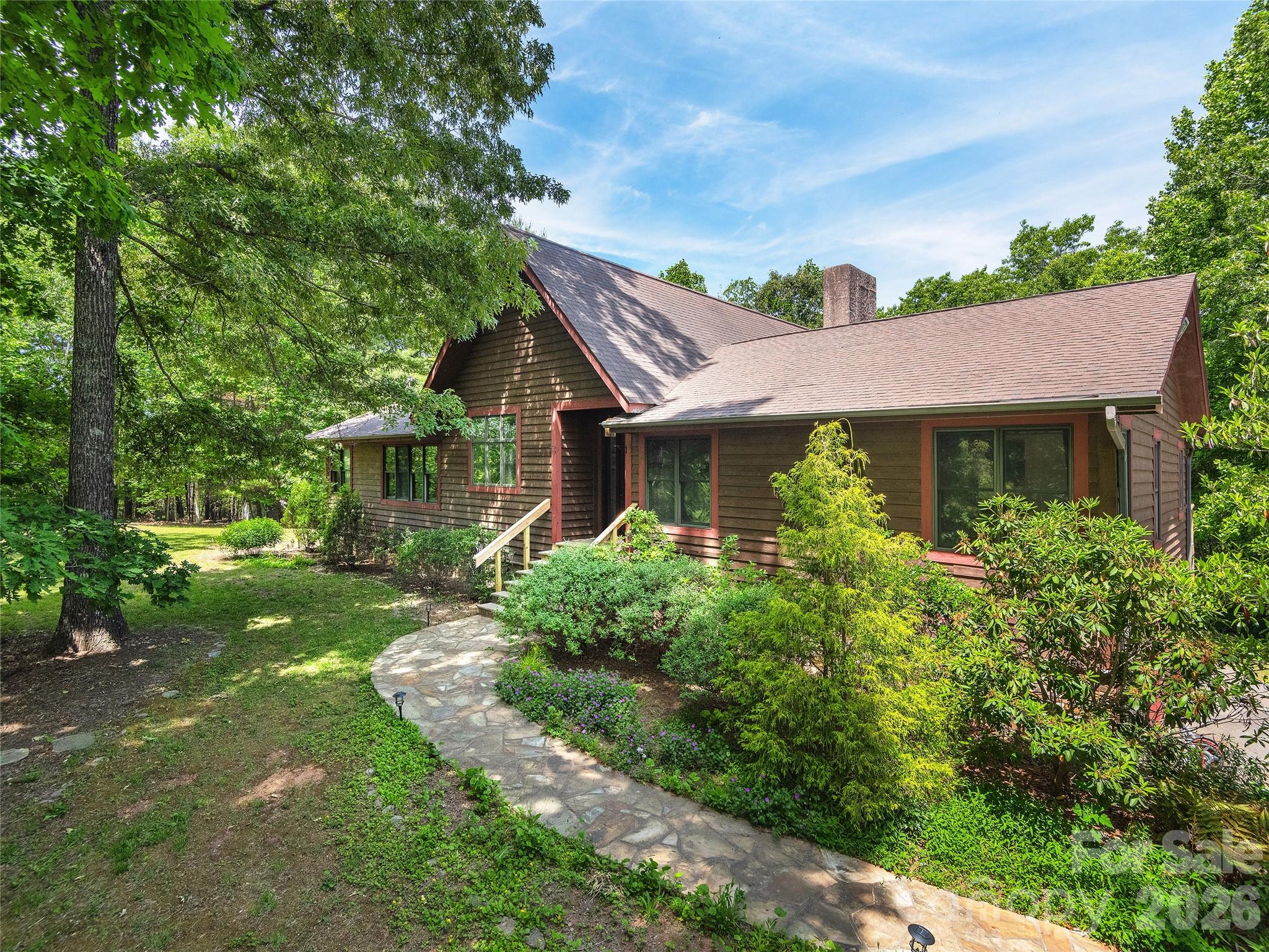 40 Deer Ridge Road Mills River, NC 28759 - Photo 1 of 35 a front view of a house with a yard