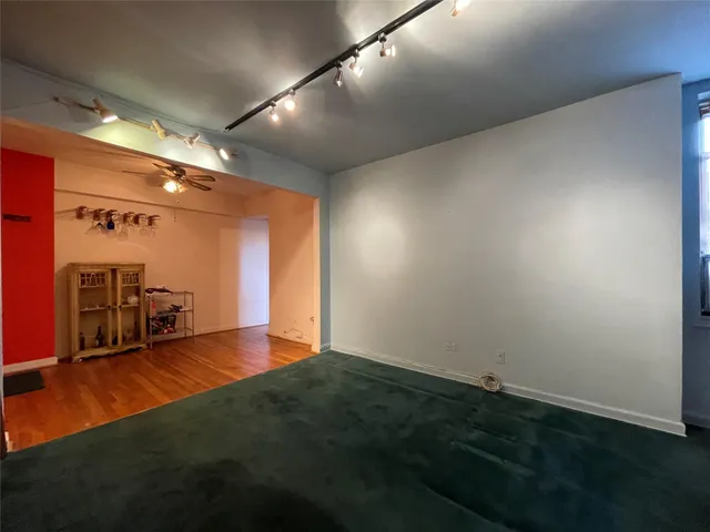 a view of street with parked cars