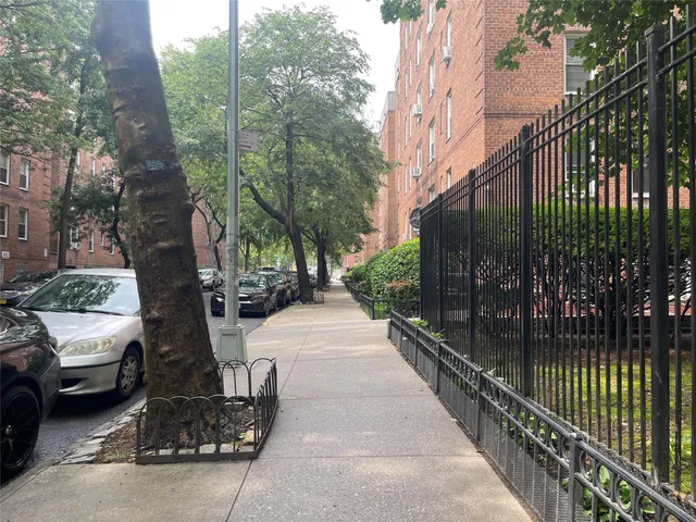 a view of a street with houses on both side