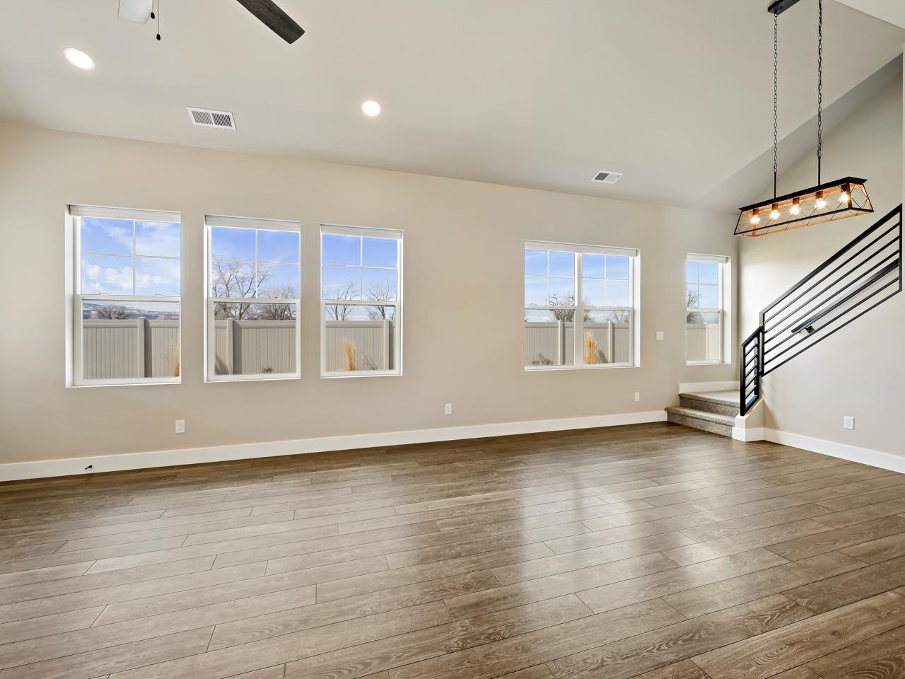 823 Red Apple Road Grand Junction, CO 81505 - Photo 11 of 38 a view of an empty room with wooden floor and a window