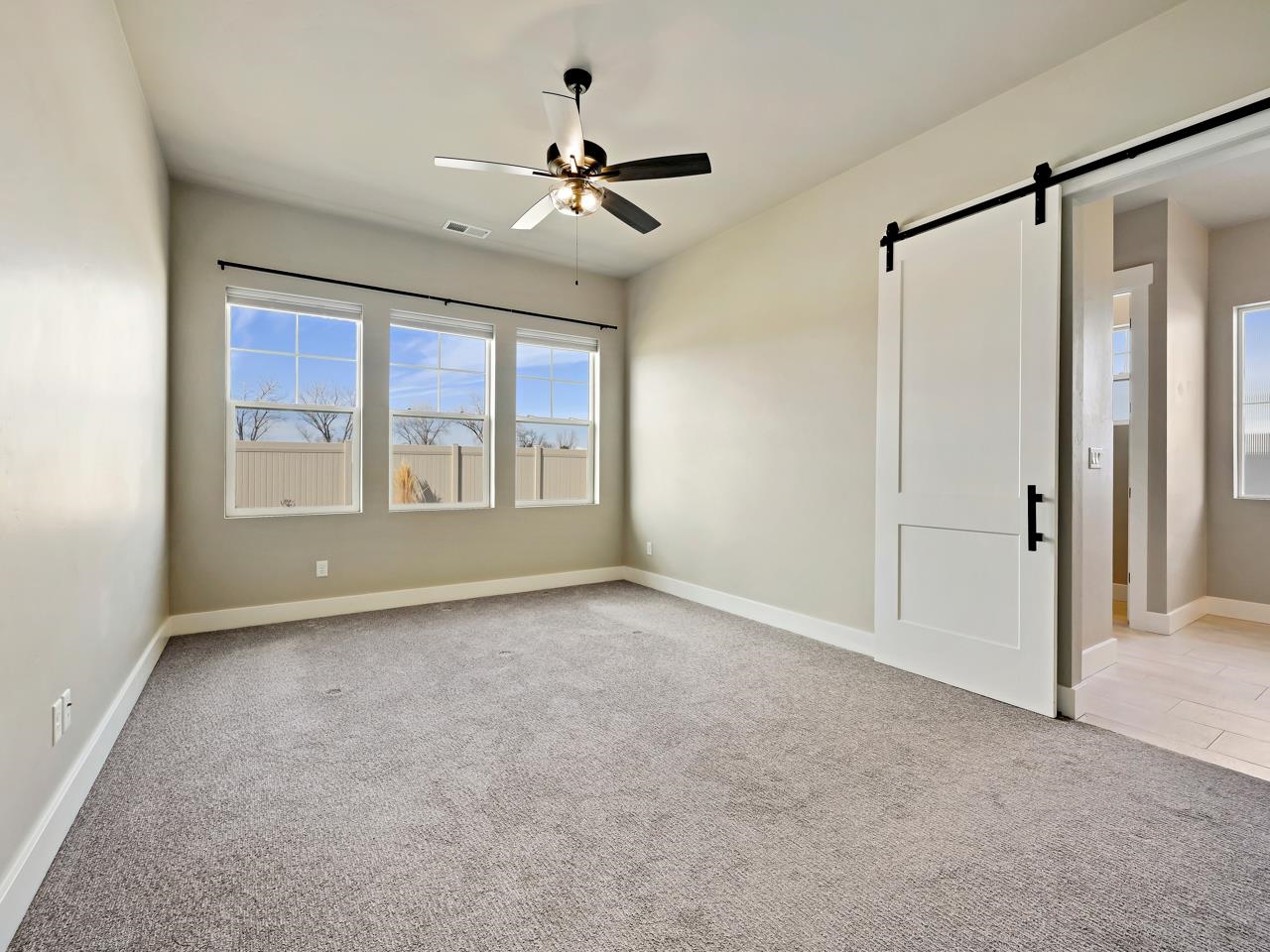 823 Red Apple Road Grand Junction, CO 81505 - Photo 12 of 38 a view of an empty room with a window