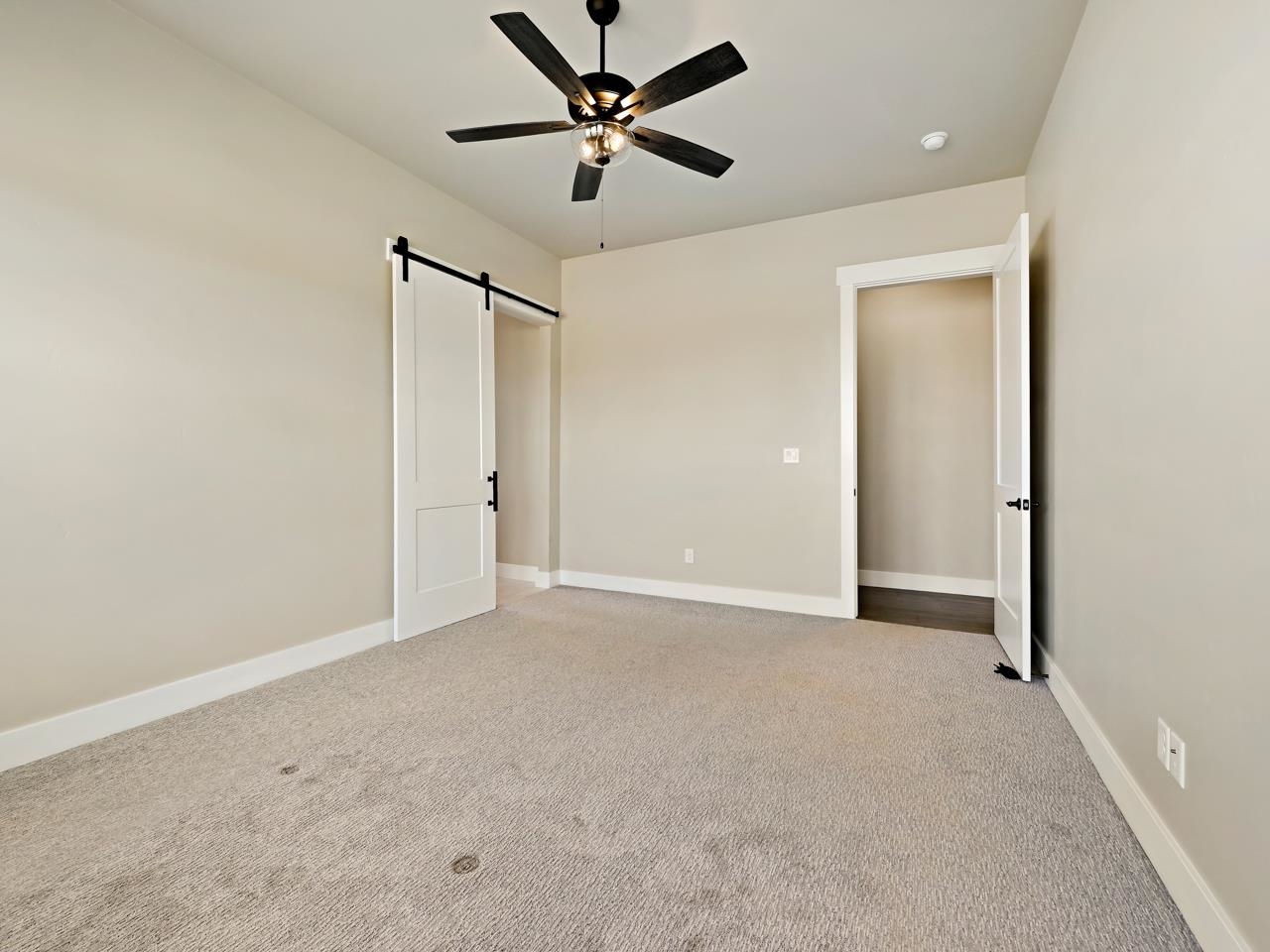 823 Red Apple Road Grand Junction, CO 81505 - Photo 13 of 38 an empty room with closet and windows