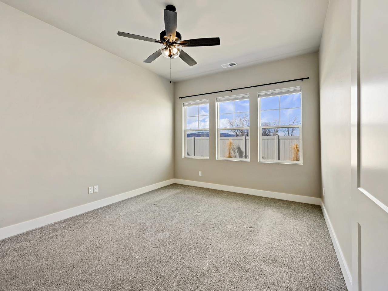 823 Red Apple Road Grand Junction, CO 81505 - Photo 14 of 38 a view of an empty room with a window