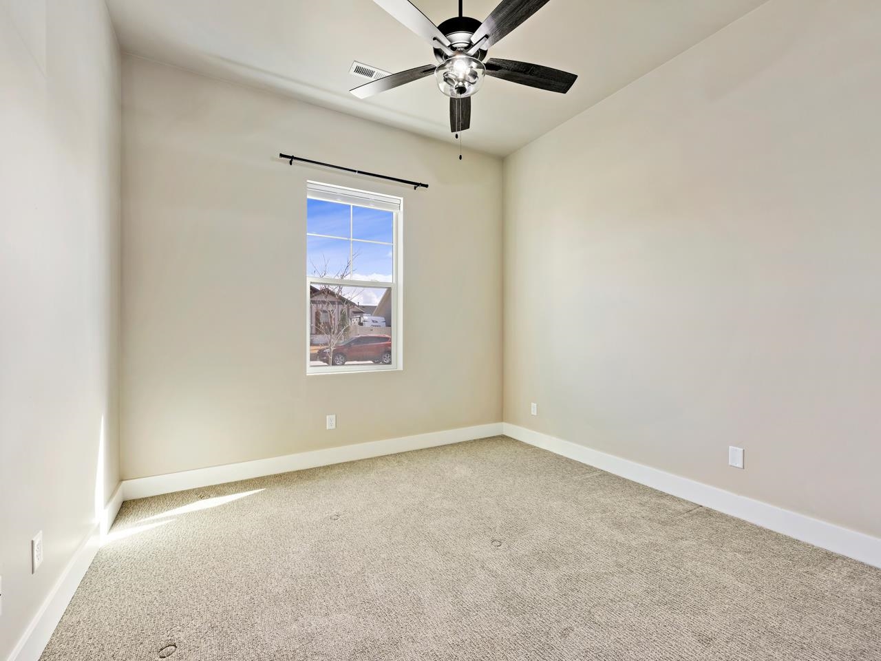 823 Red Apple Road Grand Junction, CO 81505 - Photo 20 of 38 an empty room with windows and fan