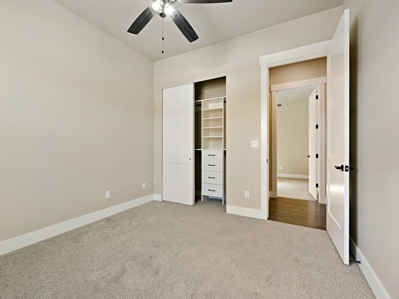 823 Red Apple Road Grand Junction, CO 81505 - Photo 21 of 38 an empty room with closet and a chandelier fan