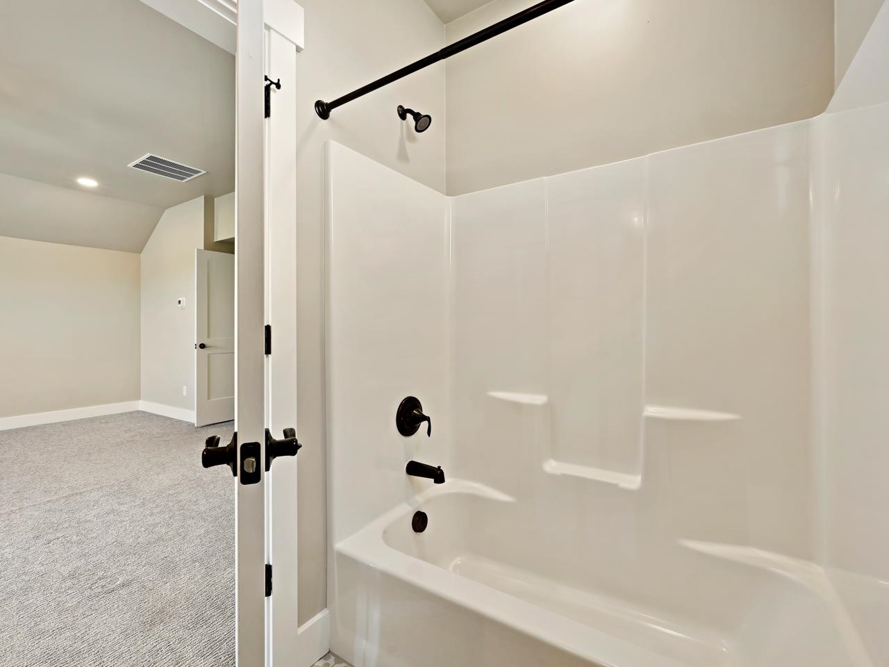 823 Red Apple Road Grand Junction, CO 81505 - Photo 29 of 38 a bathroom with a bathtub and shower