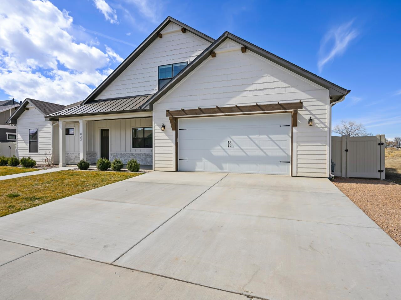 823 Red Apple Road Grand Junction, CO 81505 - Photo 38 of 38 a front view of a house with a yard and garage