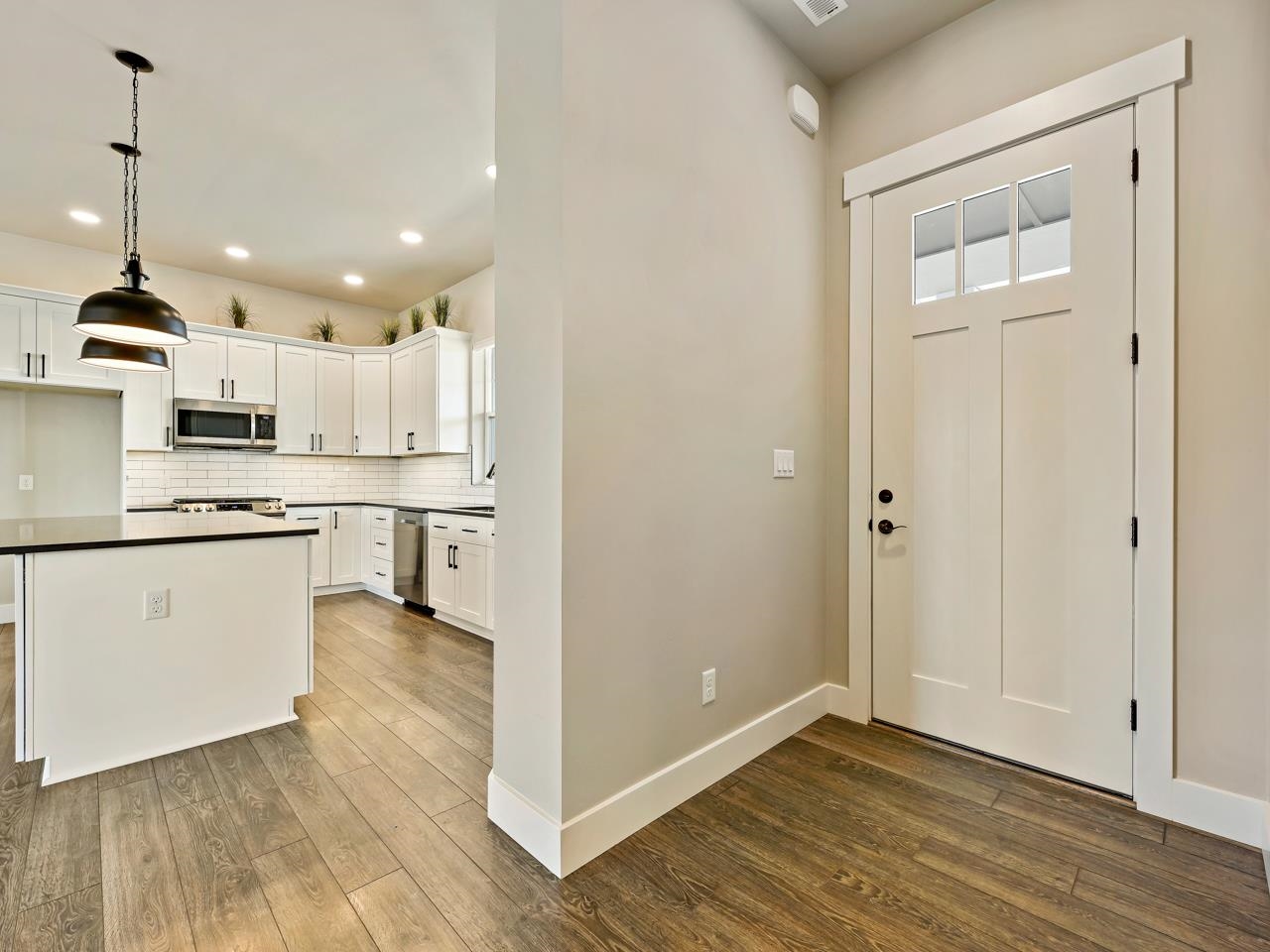 823 Red Apple Road Grand Junction, CO 81505 - Photo 4 of 38 a view of a kitchen with wooden floor