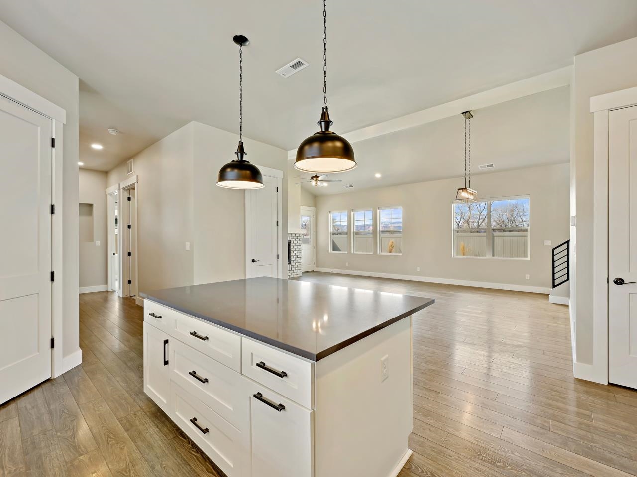823 Red Apple Road Grand Junction, CO 81505 - Photo 8 of 38 a kitchen with stainless steel appliances granite countertop a sink a window and chairs