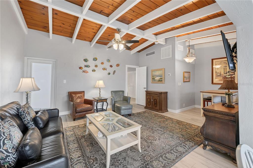 6006 Midnight Pass Road, Unit 21 Sarasota, FL 34242 - Photo 6 of 24 a living room with furniture