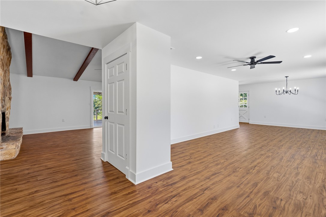 208 Williamsburg Road Anderson, SC 29621 - Photo 5 of 48 Rich wood flooring runs throughout this airy, open-concept living area with classic exposed ceiling beams.