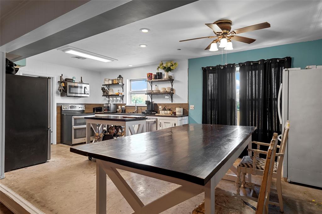 2139 Meandering Way China Spring, TX 76633 - Photo 3 of 20 a kitchen with stainless steel appliances granite countertop a refrigerator a sink a stove and a refrigerator