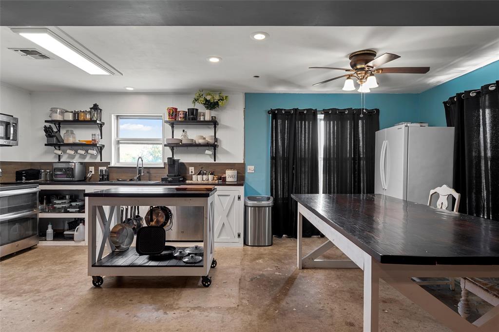 2139 Meandering Way China Spring, TX 76633 - Photo 4 of 20 a kitchen with stainless steel appliances granite countertop a refrigerator a sink and a stove