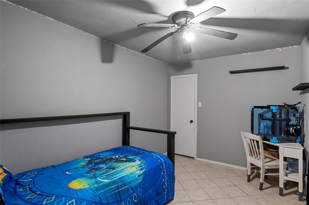 2139 Meandering Way China Spring, TX 76633 - Photo 6 of 20 a bedroom with a bed and a chandelier