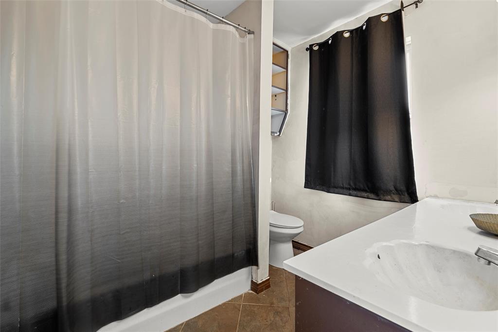 2139 Meandering Way China Spring, TX 76633 - Photo 8 of 20 a bathroom with a sink a toilet and shower