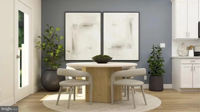a living room with furniture and potted plant