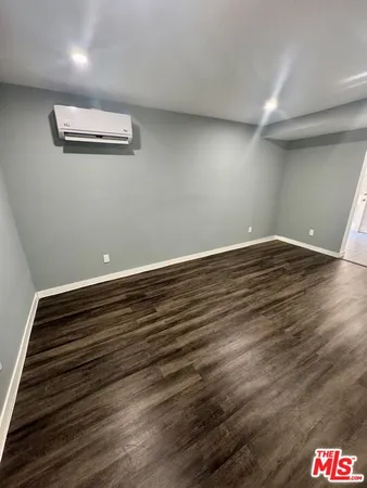 a view of room with wooden floor