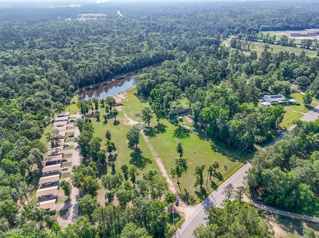 an aerial view of residential house with outdoor space and swimming pool