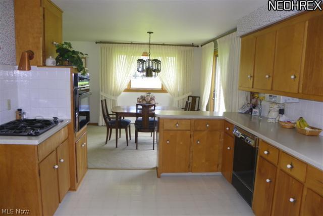 2434 Woodview Road Uniontown, OH 44685 - Photo 8 of 23 View of kitchen & formal dining area