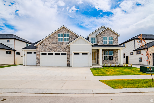 223 South Cottonwood Road, Unit 7501 Vineyard, UT 84059 - Photo 1 of 45 Contemporary two-story residence featuring a stone and siding facade