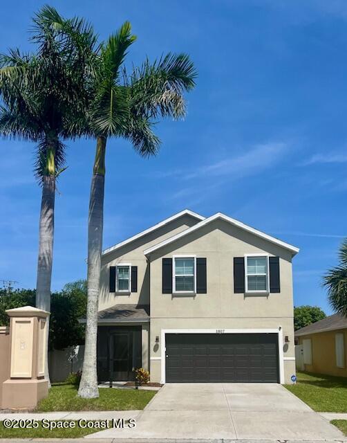 1807 Elkins Point Melbourne, FL 32935 - Photo 3 of 13 a front view of a house with a garden