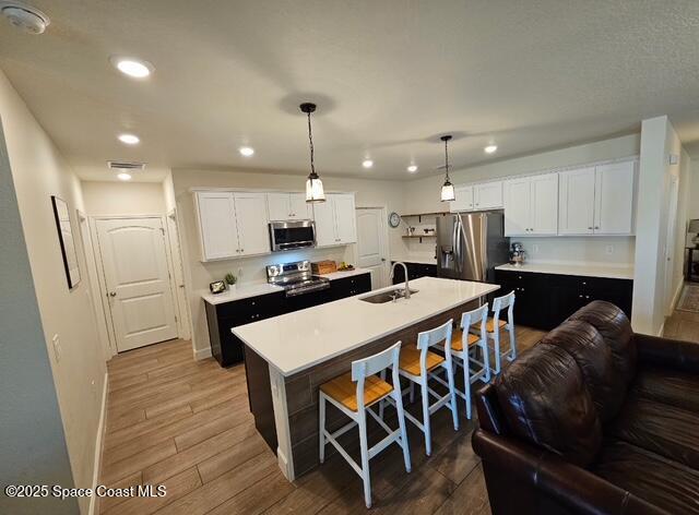 1807 Elkins Point Melbourne, FL 32935 - Photo 8 of 13 a large kitchen with a table and chairs