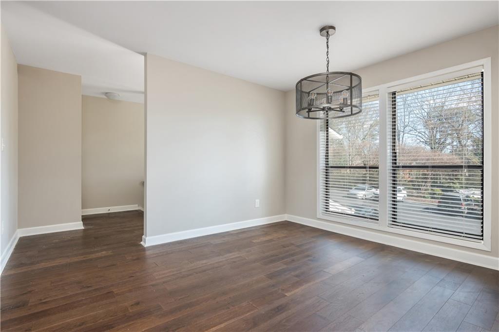 1211 Wynnes Ridge Circle Marietta, GA 30067 - Photo 12 of 35 a view of an empty room with wooden floor and a window
