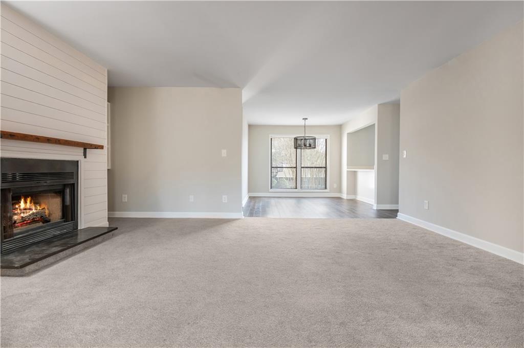 1211 Wynnes Ridge Circle Marietta, GA 30067 - Photo 18 of 35 an empty room with windows and fireplace