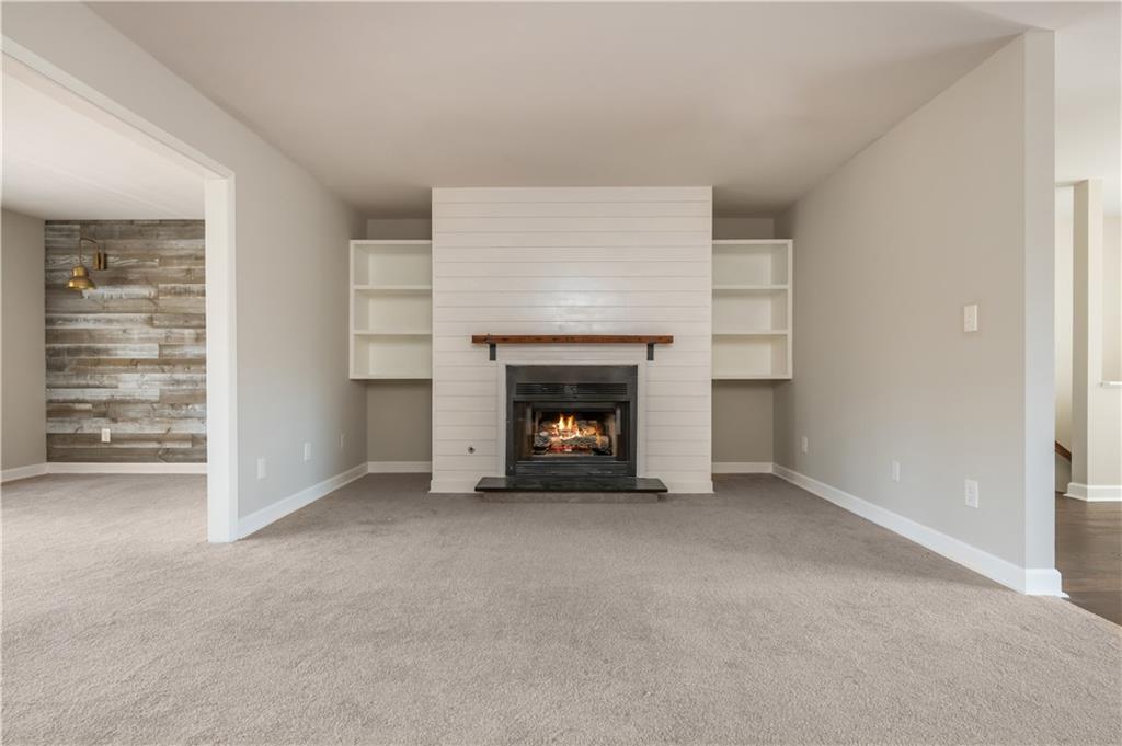 1211 Wynnes Ridge Circle Marietta, GA 30067 - Photo 19 of 35 a view of an empty room with a fireplace