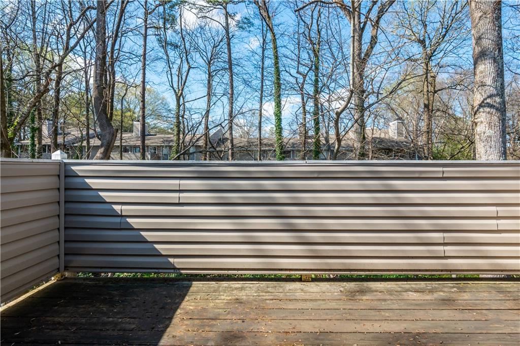 1211 Wynnes Ridge Circle Marietta, GA 30067 - Photo 23 of 35 a view of outdoor space and deck with lots of green space