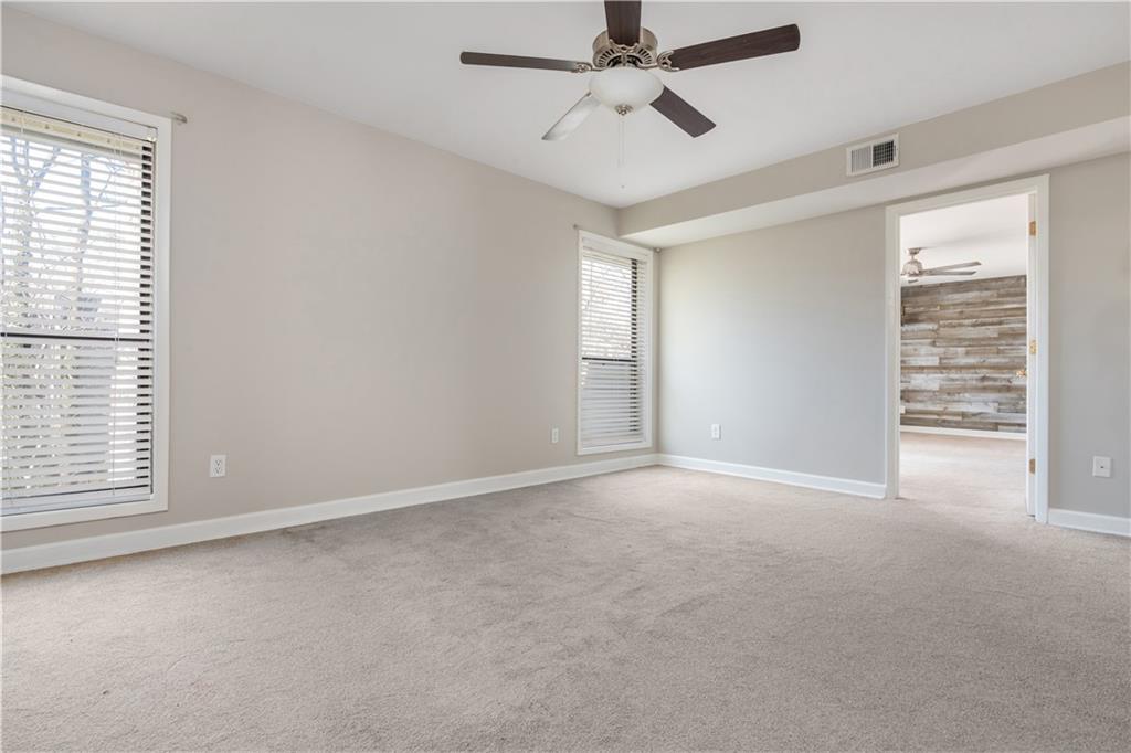 1211 Wynnes Ridge Circle Marietta, GA 30067 - Photo 24 of 35 an empty room with windows and fan