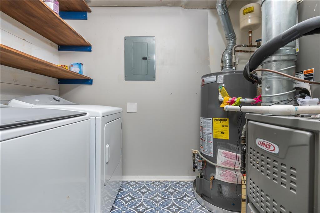1211 Wynnes Ridge Circle Marietta, GA 30067 - Photo 31 of 35 a utility room with dryer and washer
