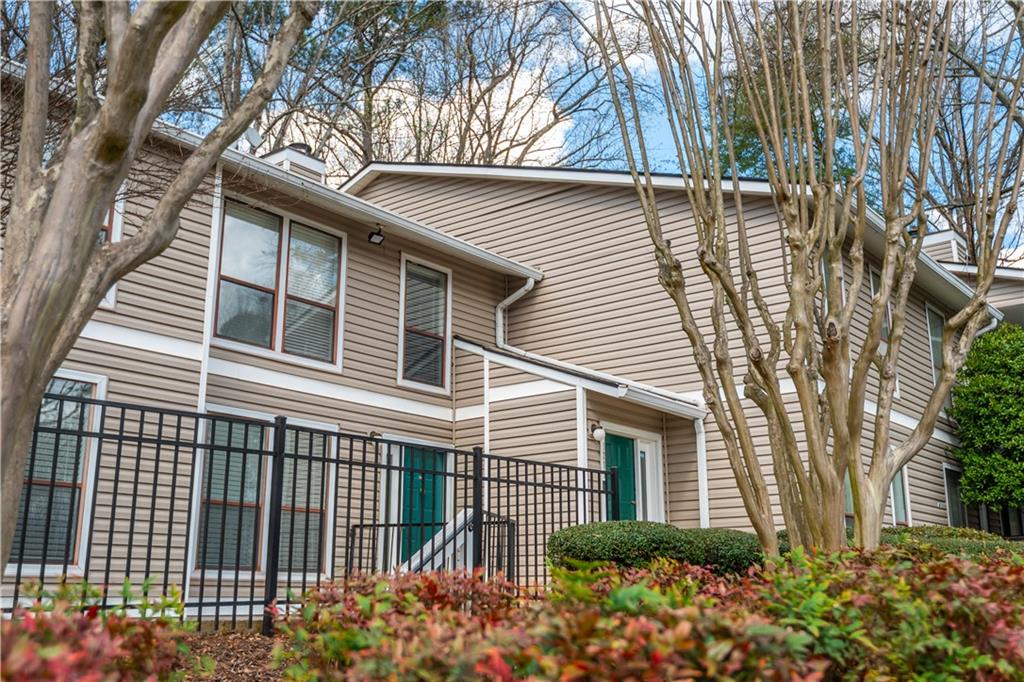 1211 Wynnes Ridge Circle Marietta, GA 30067 - Photo 35 of 35 a front view of a house with a garden