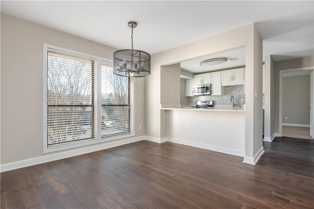 1211 Wynnes Ridge Circle Marietta, GA 30067 - Photo 5 of 35 a view of wooden floor and chandelier in a room