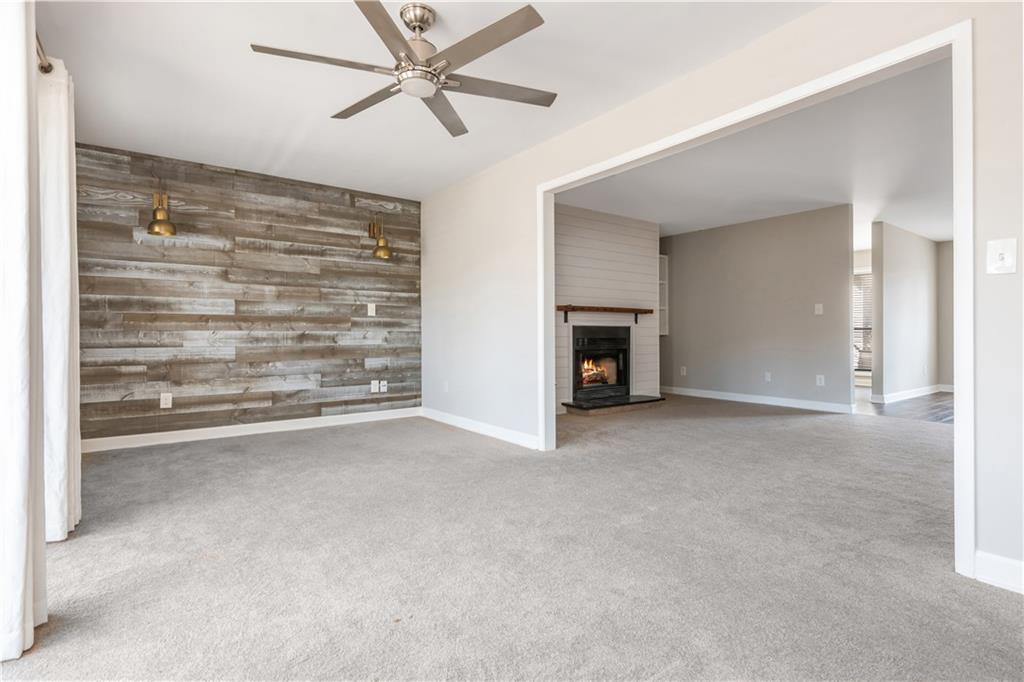 1211 Wynnes Ridge Circle Marietta, GA 30067 - Photo 9 of 35 a view of an empty room with a fireplace and a window