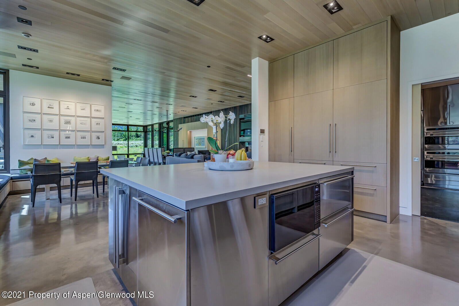 276 Coach Road Aspen, CO 81611 - Photo 17 of 68 a kitchen with a stove a table and chairs