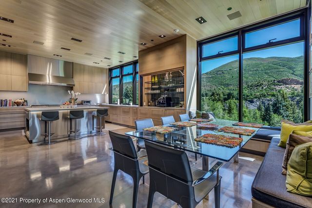 a view of a house with garden and a patio