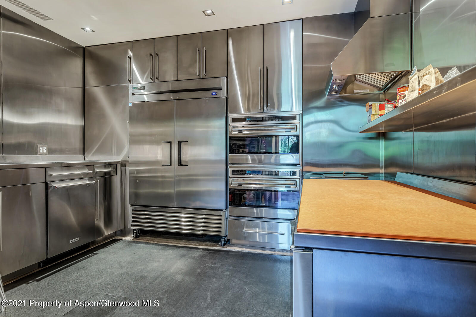 276 Coach Road Aspen, CO 81611 - Photo 19 of 68 a kitchen with stainless steel appliances granite countertop a refrigerator and a stove