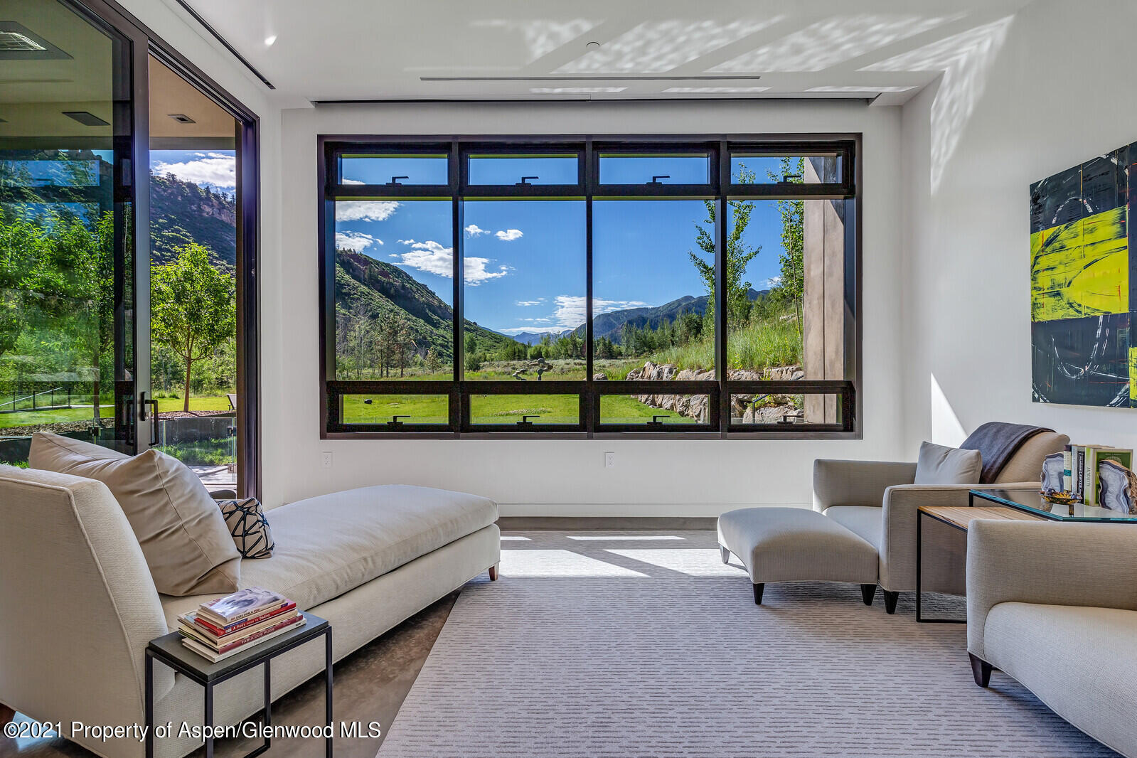 276 Coach Road Aspen, CO 81611 - Photo 28 of 68 a living room with furniture and a floor to ceiling window