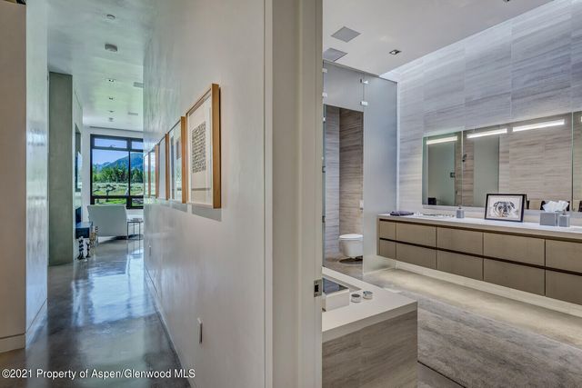 a view of a living room and hallway