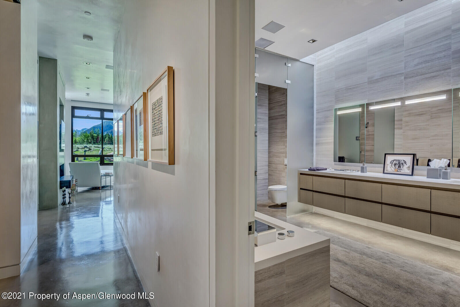 276 Coach Road Aspen, CO 81611 - Photo 38 of 68 a bathroom with a sink a mirror and a shower