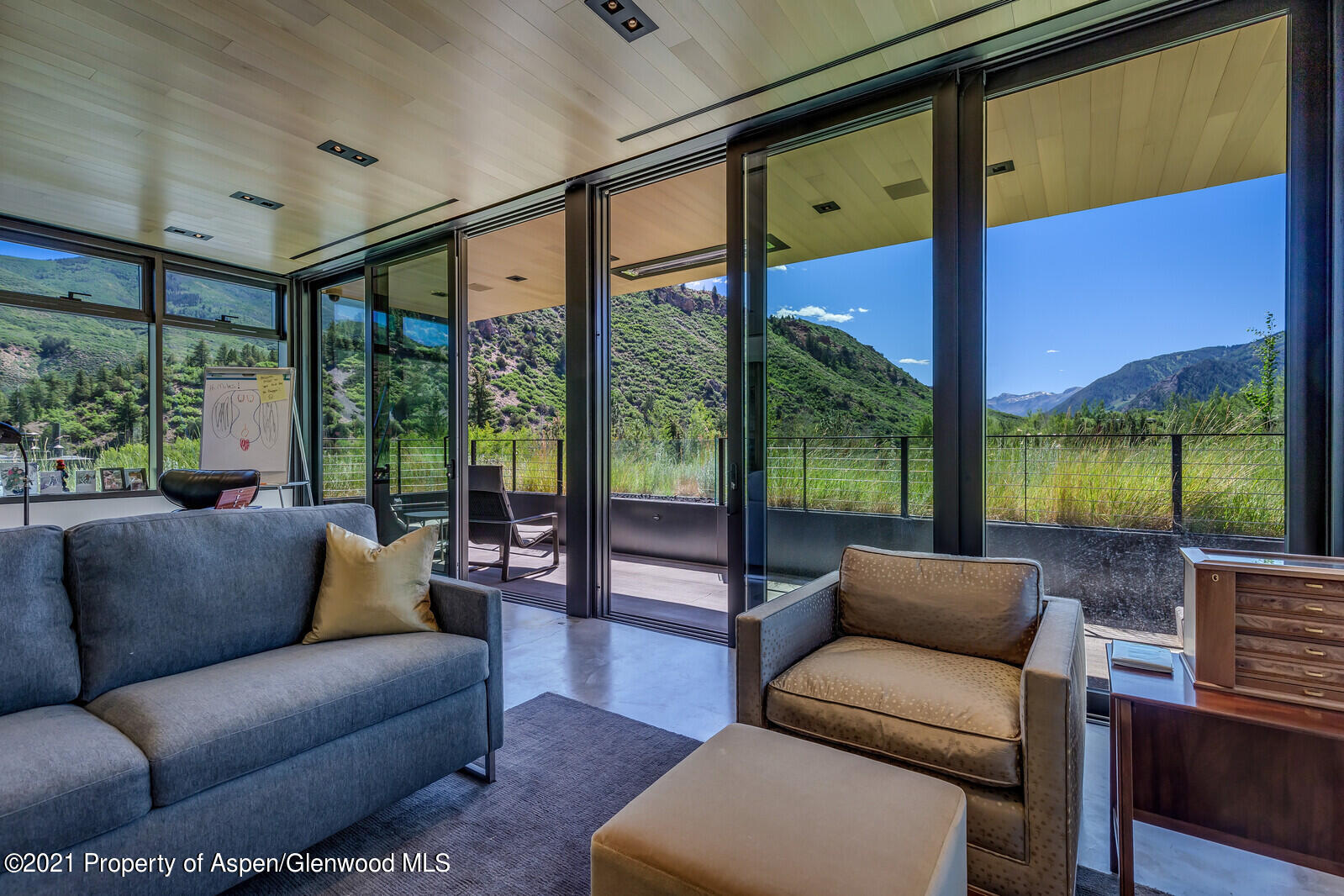 276 Coach Road Aspen, CO 81611 - Photo 39 of 68 a living room with furniture and a large window