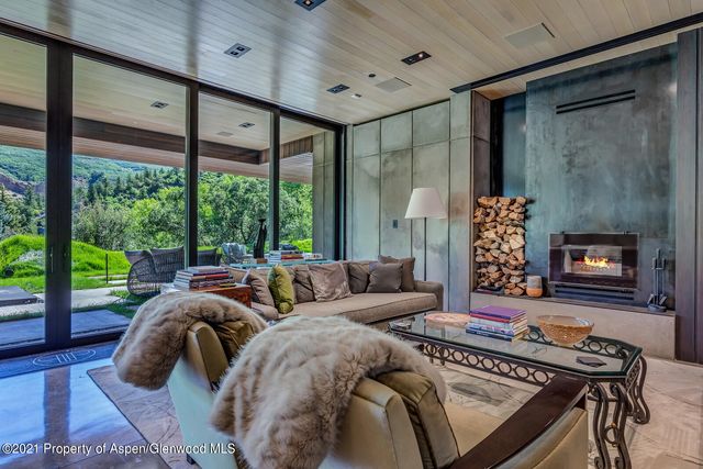 a bedroom with a large bed and a large window