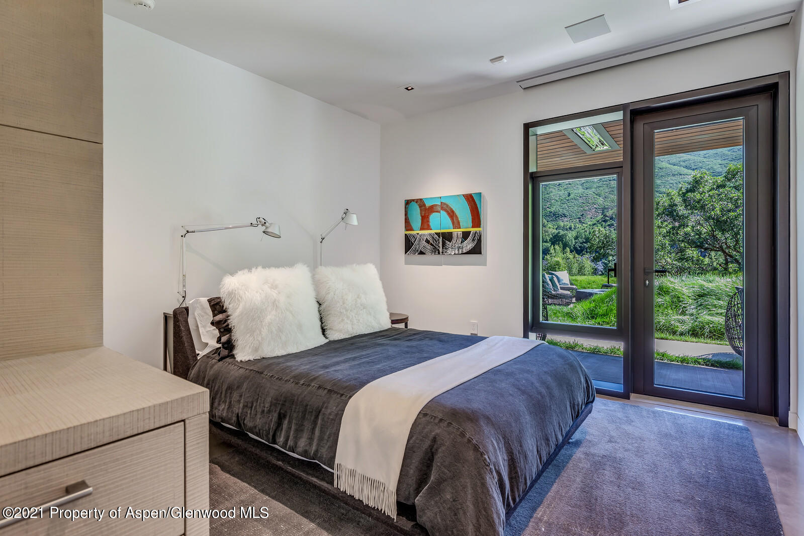 276 Coach Road Aspen, CO 81611 - Photo 59 of 68 a bedroom with a bed and a large window