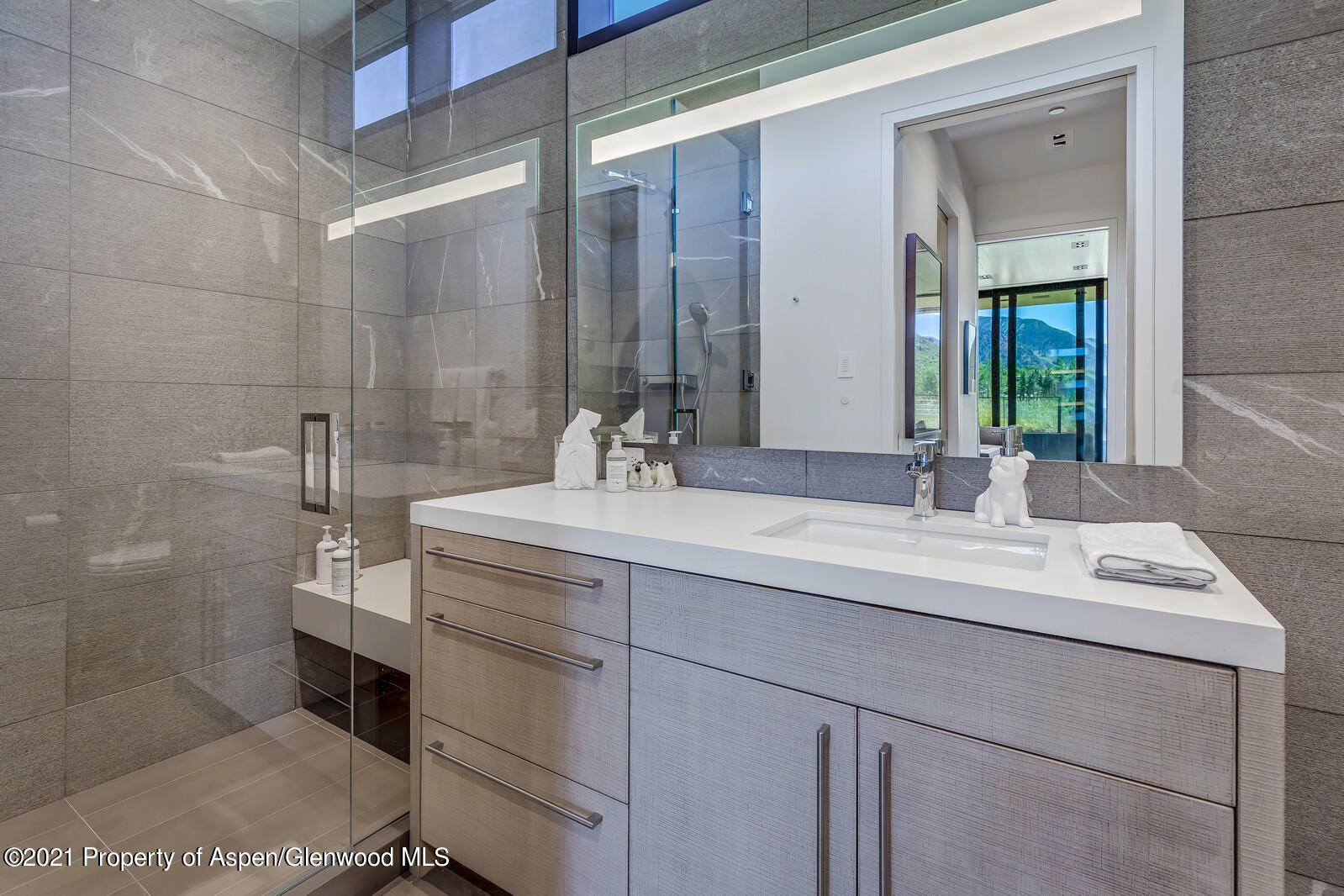 276 Coach Road Aspen, CO 81611 - Photo 60 of 68 a bathroom with a sink and a mirror