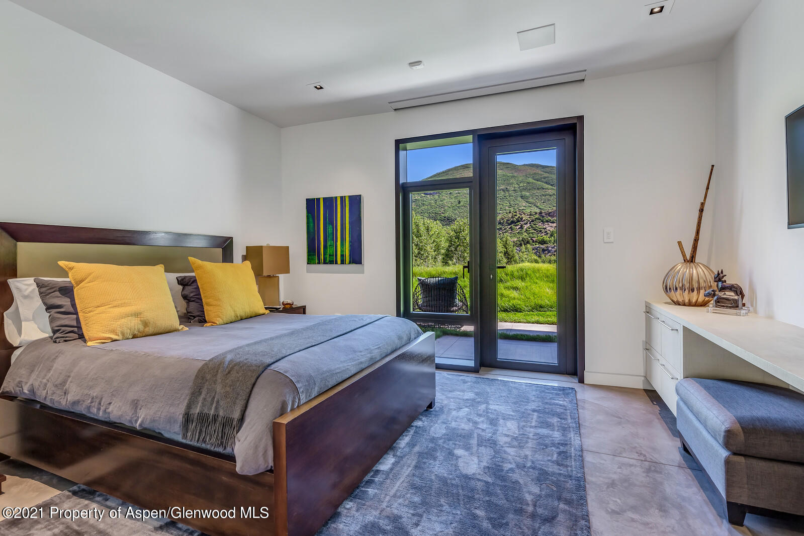 276 Coach Road Aspen, CO 81611 - Photo 61 of 68 a bedroom with a large bed and a large window